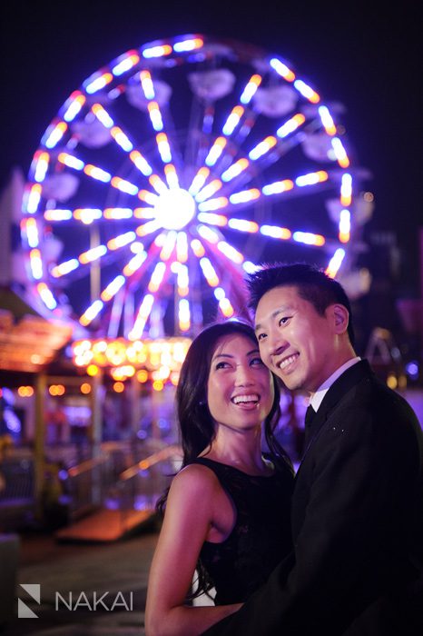 ferris wheel carnival at night engagement photo