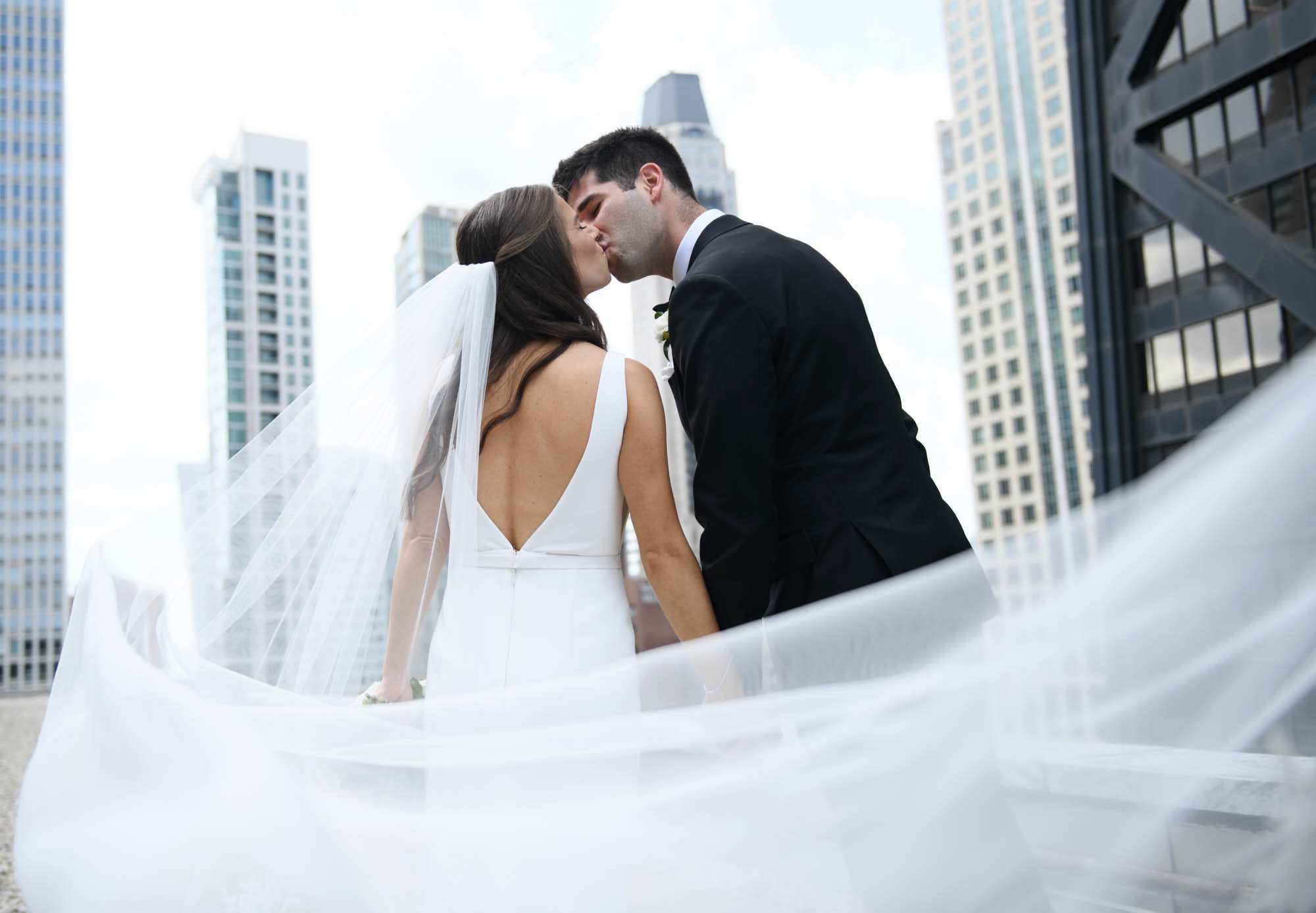 Chicago bride groom kissing veil swoop