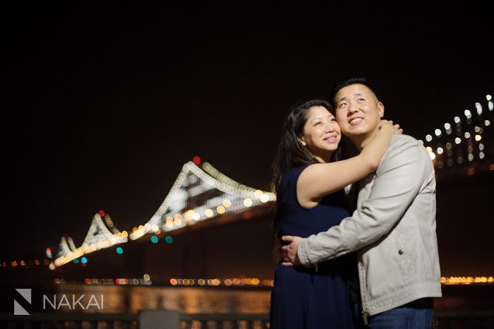 San Francisco bay bridge rincon park engagement picture at night