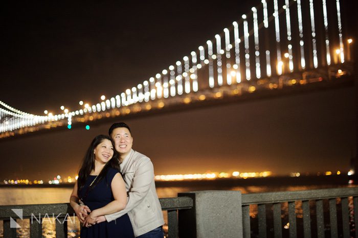 San Francisco bay bridge rincon park engagement picture at night