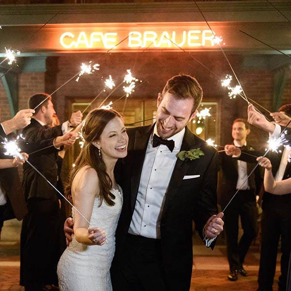 cafe brauer wedding photo bride groom sparklers at night