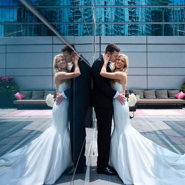 Loews Chicago Hotel wedding photo, rooftop reflection w/couple kissing