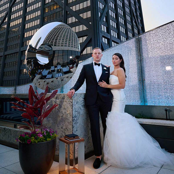 Ritz Carlton Chicago wedding photo, bride and groom on rooftop with john hancock in background