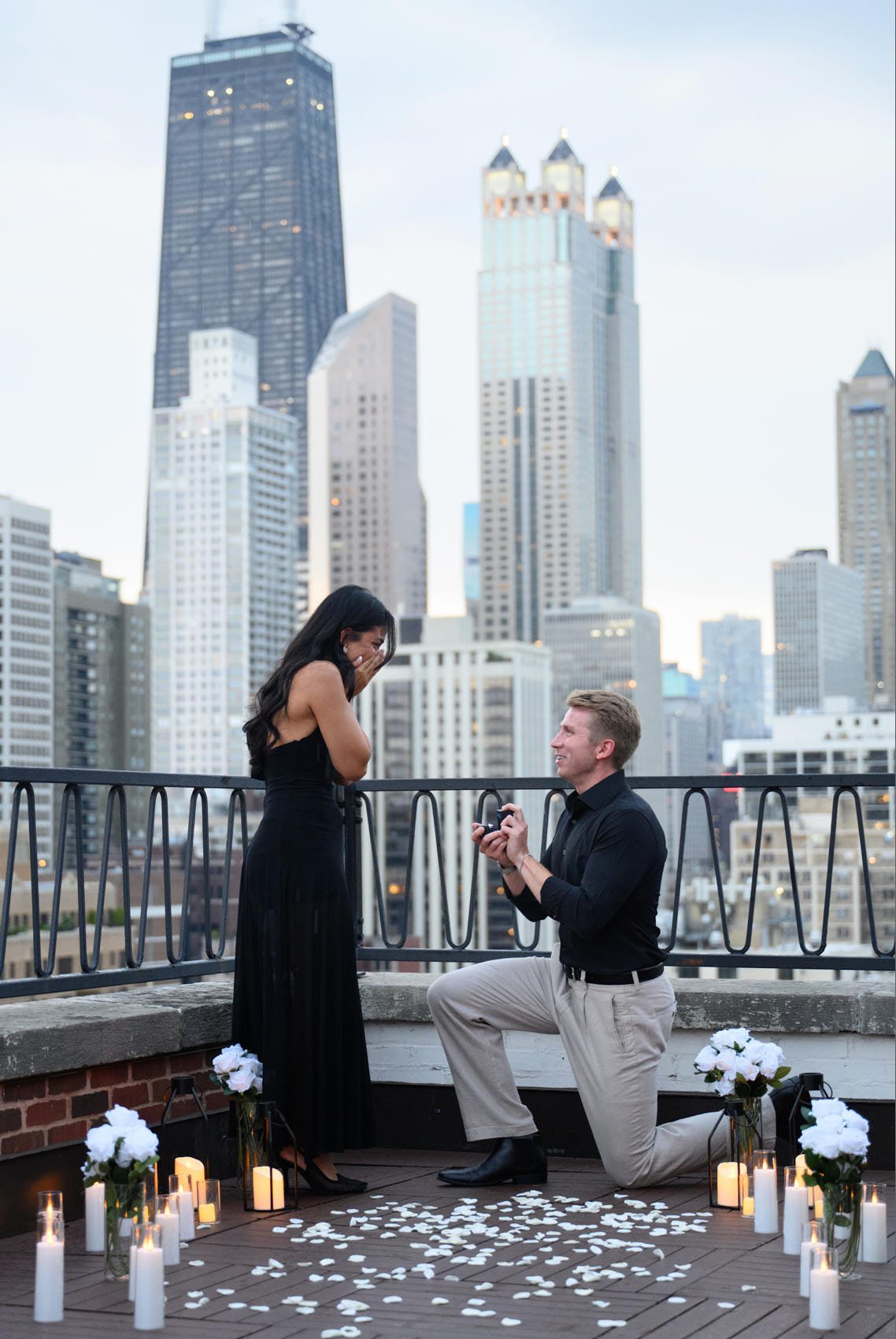 chicago proposal on rooftop woman emotional with guy on one knee