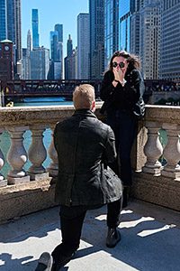 chicago riverwalk proposal location on bended knee by Chicago river and bridges