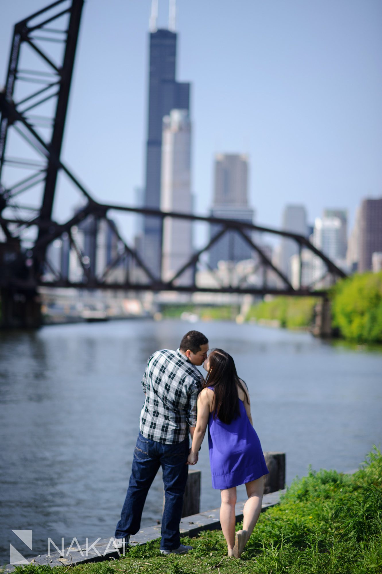 artistic chicago engagement photographer river skyline