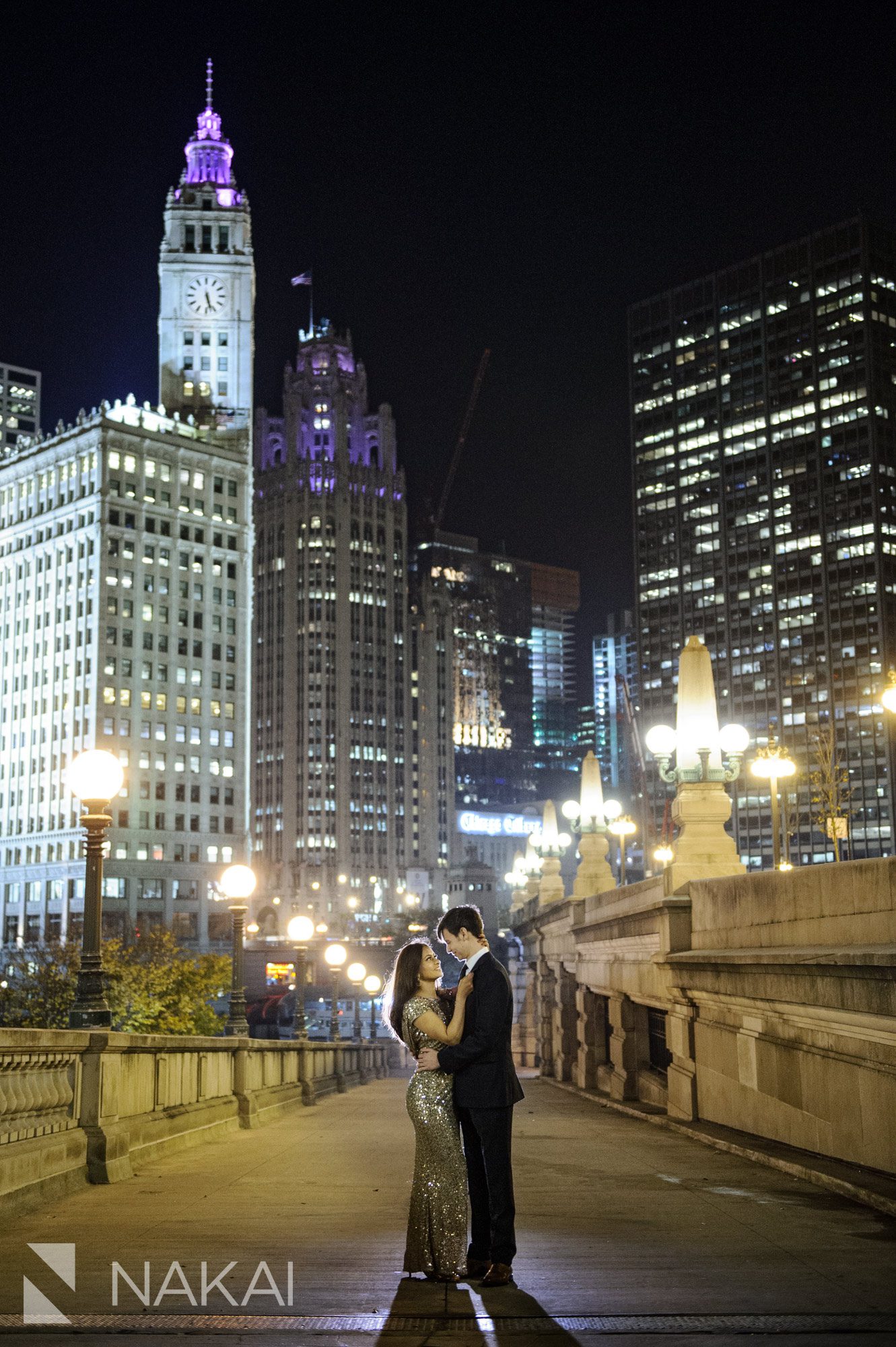 night time chicago engagement photo riverwalk