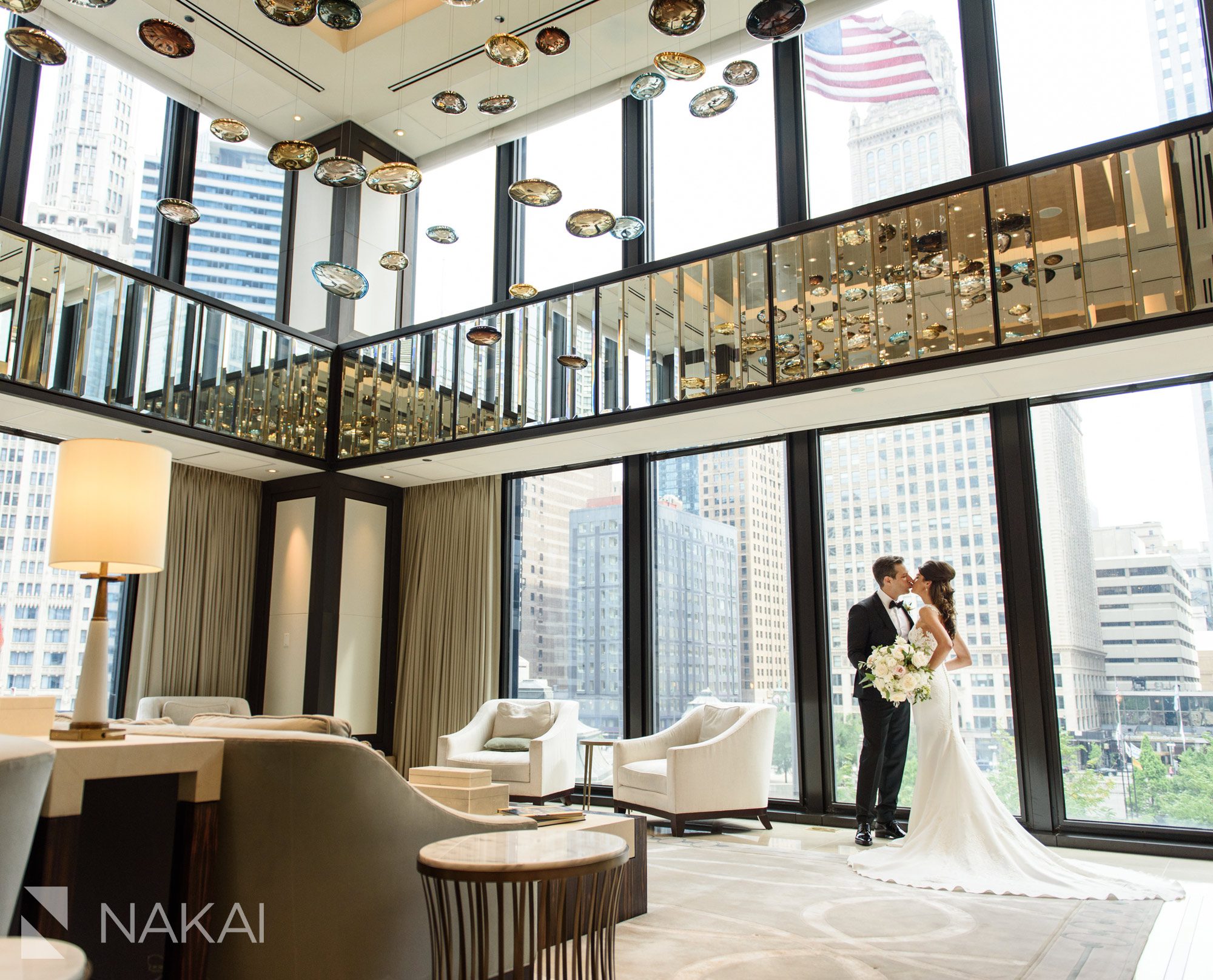 Langham Chicago photographer wedding lobby bride groom kiss