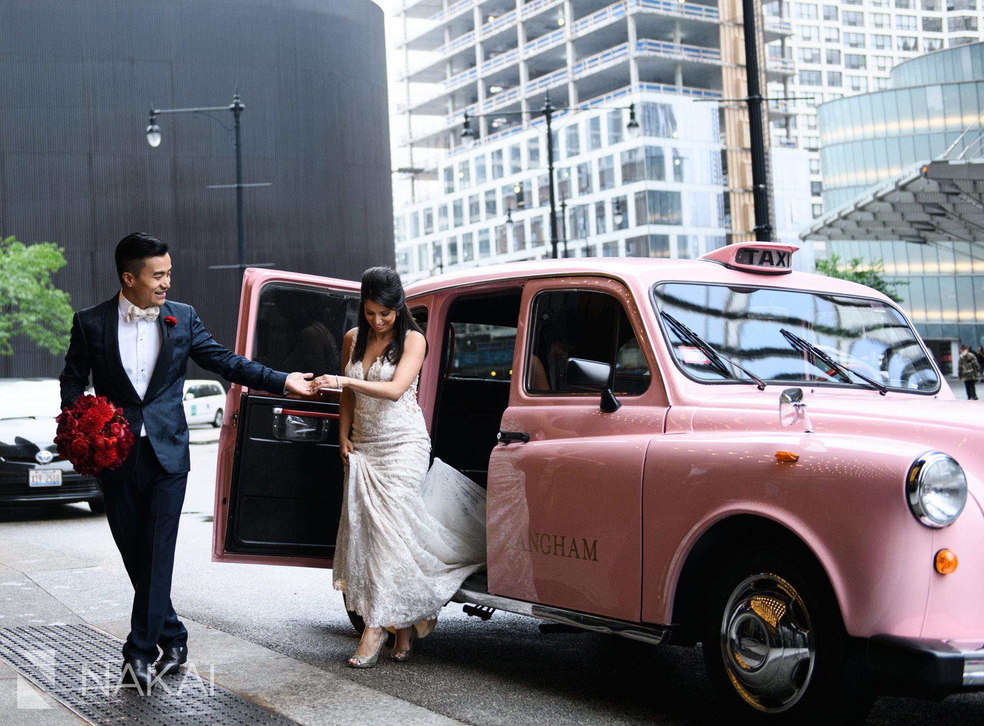 langham chicago wedding photo pink taxi bride groom 