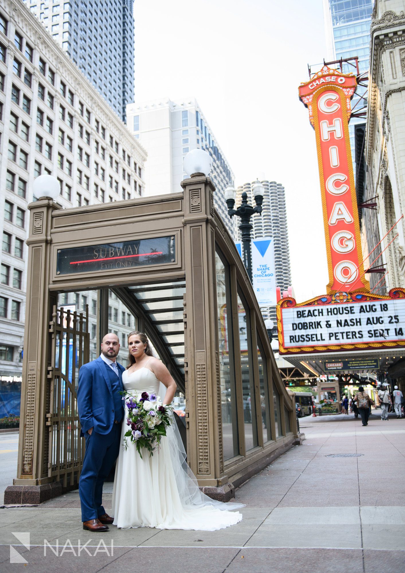 Chicago theatre sign wedding photographer bride groom