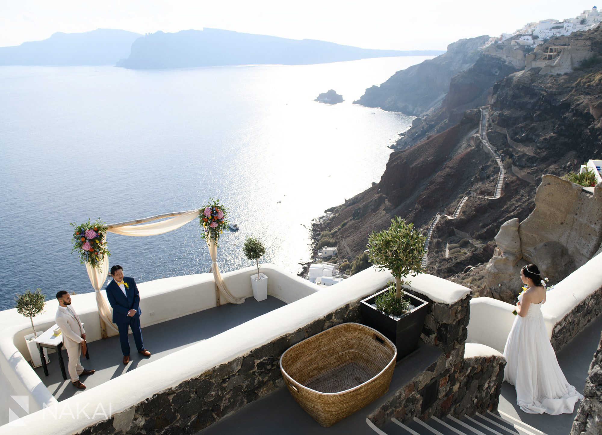 destination wedding photographer canaves suites Oia Santorini Greece ceremony