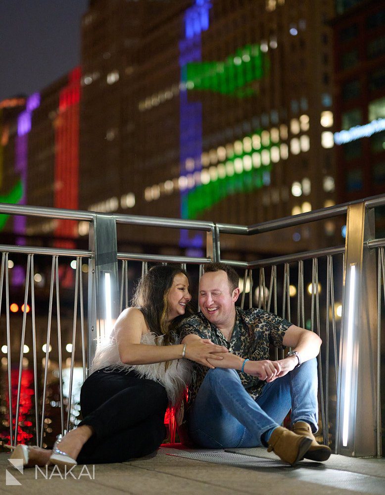 engagement photos in chicago night time riverwalk cute laugh