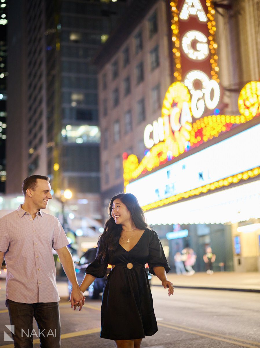 chicago riverwalk proposal photos at night Chicago Theatre sign