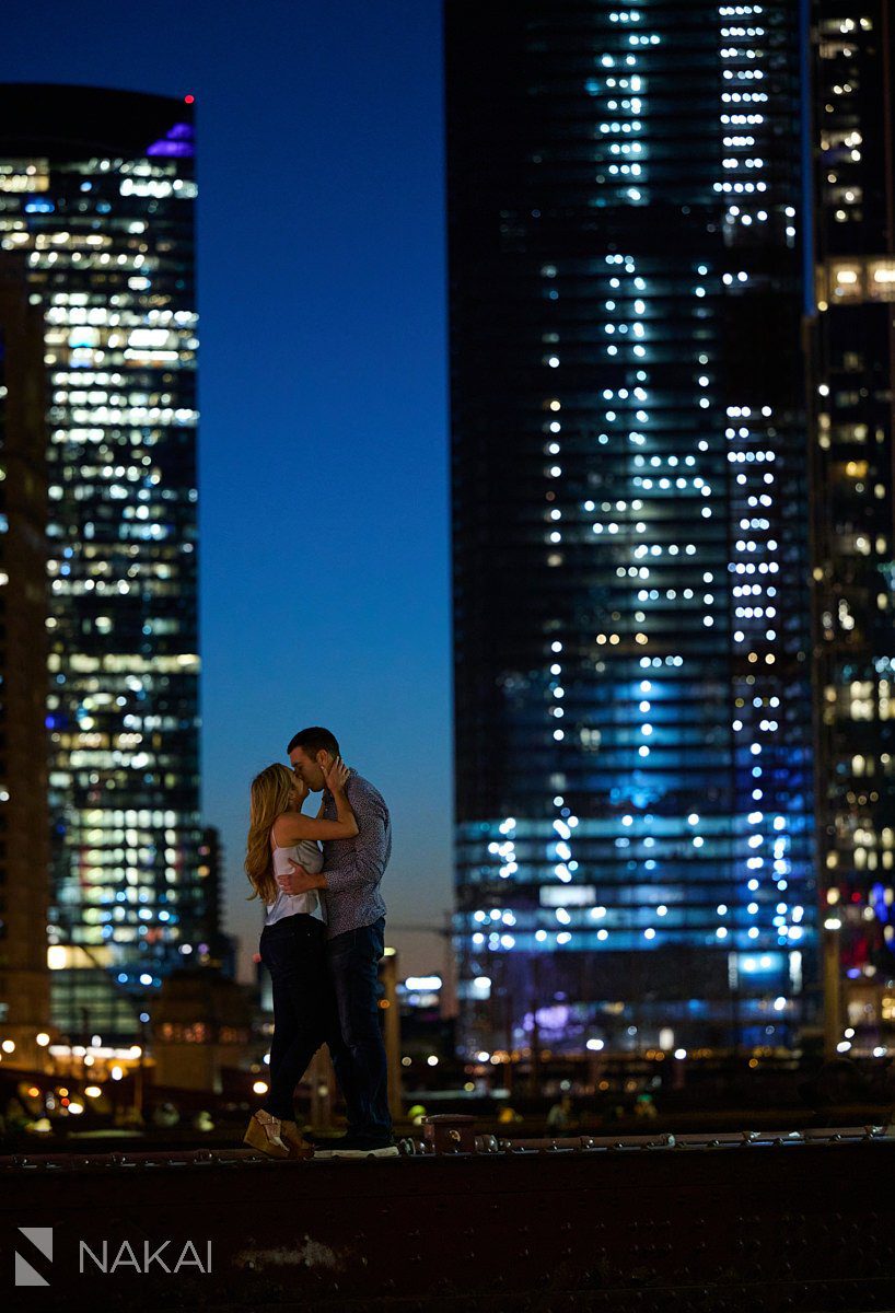 night time chicago engagement photos riverwalk