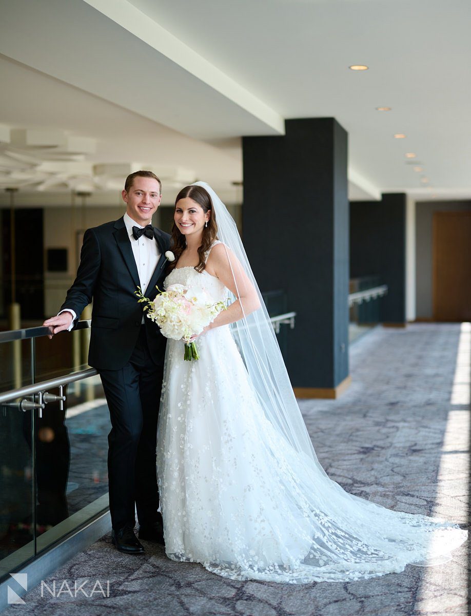 Loews chicago hotel wedding photos bride groom bridge in lobby
