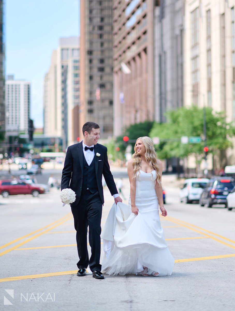 loews chicago wedding photos middle of street bride groom