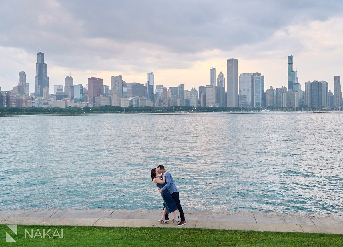 chicago adler planetarium engagement photo kiss skyline background