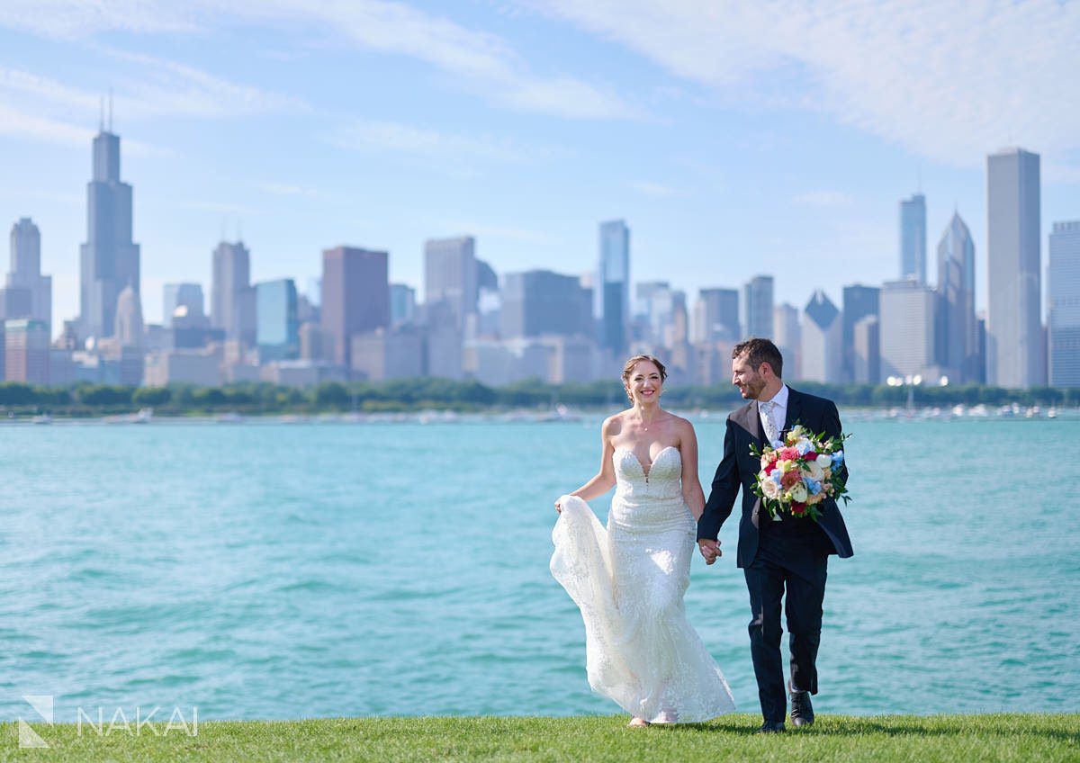 Adler Chicago wedding pictures bride and groom by planetarium with skyline