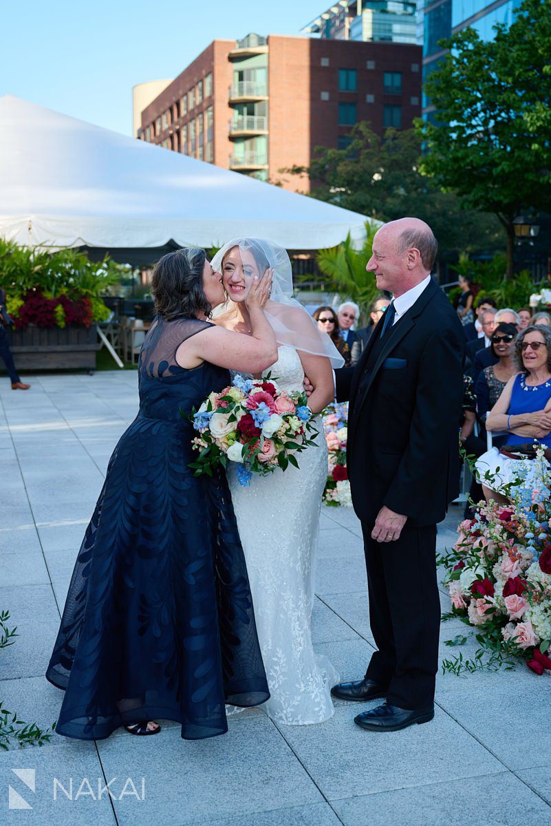 Loews Chicago Wedding pictures rooftop ceremony on terrace bride down the aisle