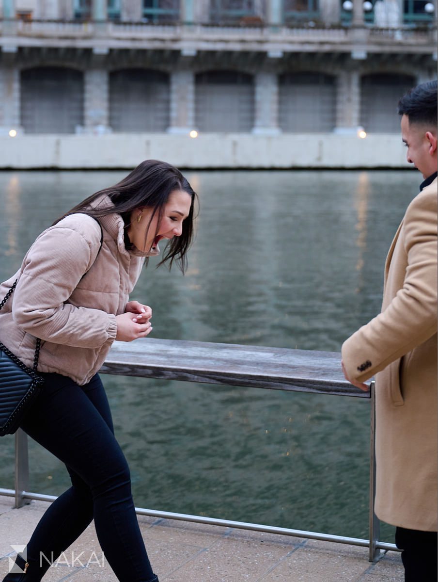 riverwalk Chicago proposal photos putting ring on surprised emotion