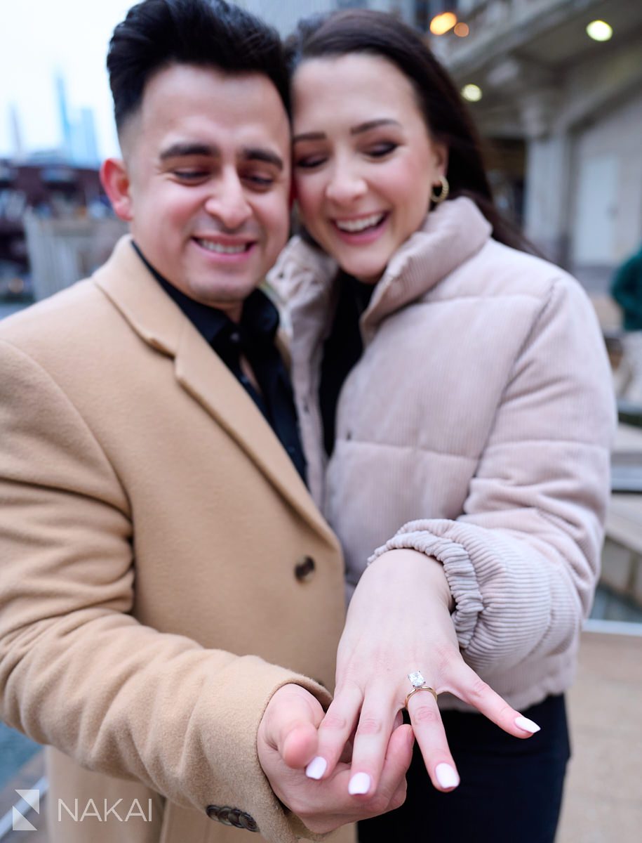 winter Chicago proposal photos riverwalk smiling with ring