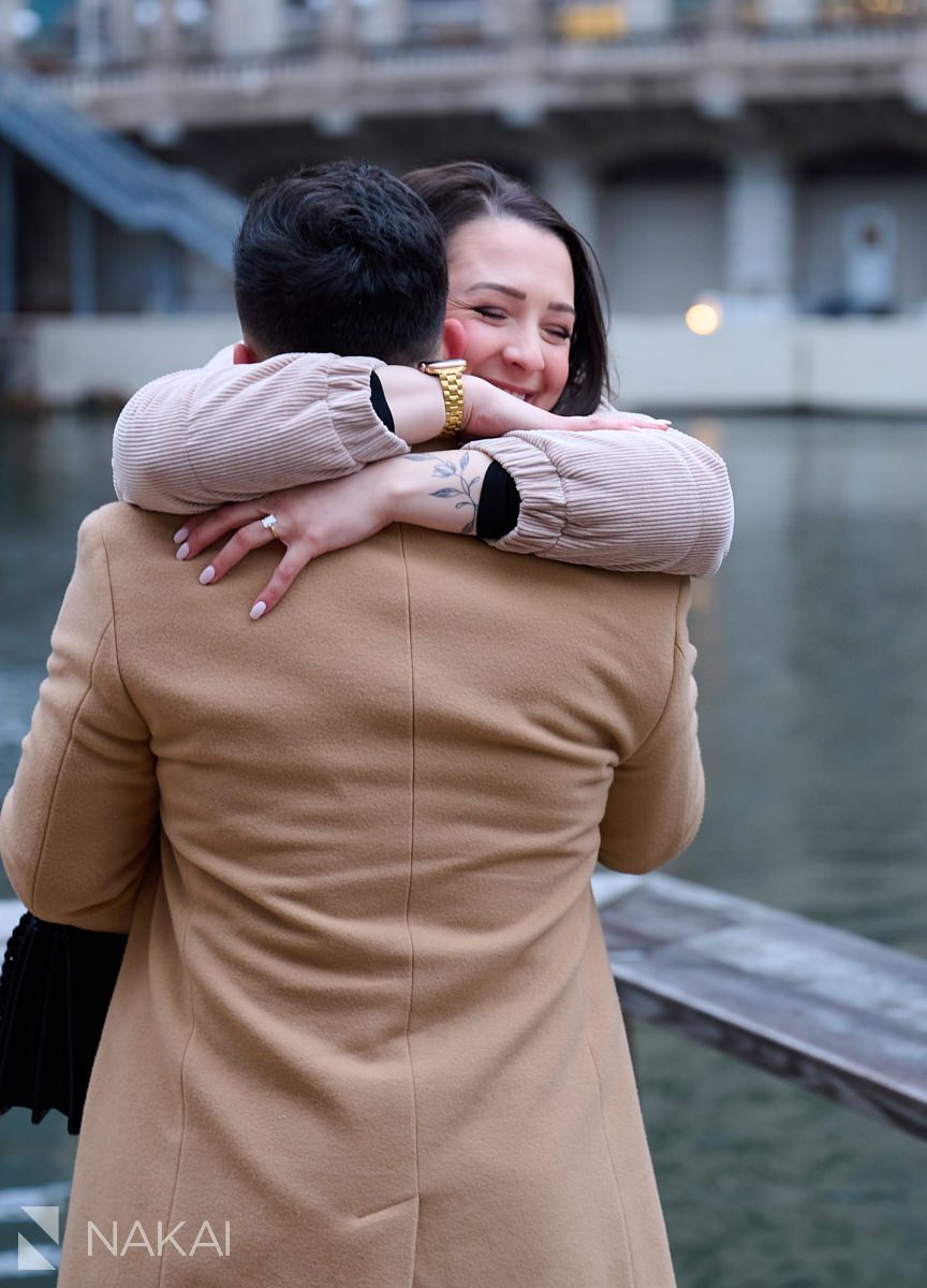winter Chicago proposal photos riverwalk hugging