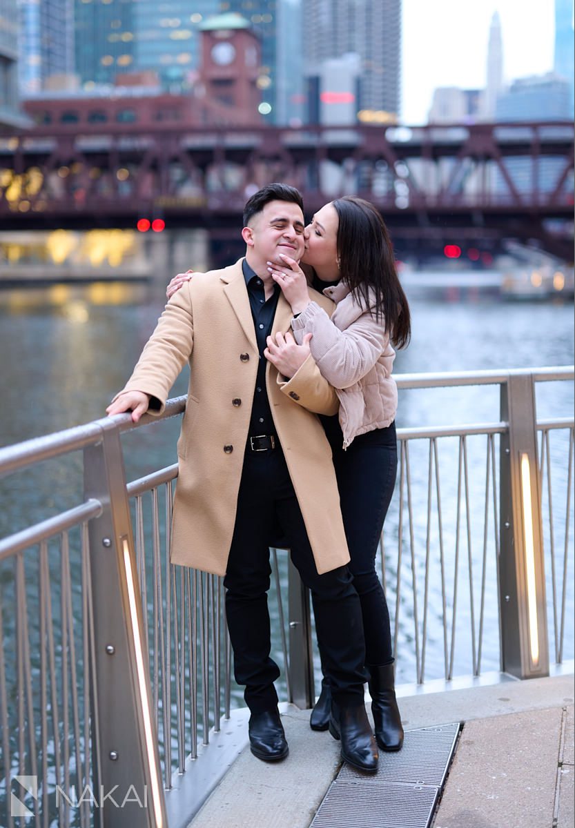 winter Chicago riverwalk proposal photos kiss on cheek