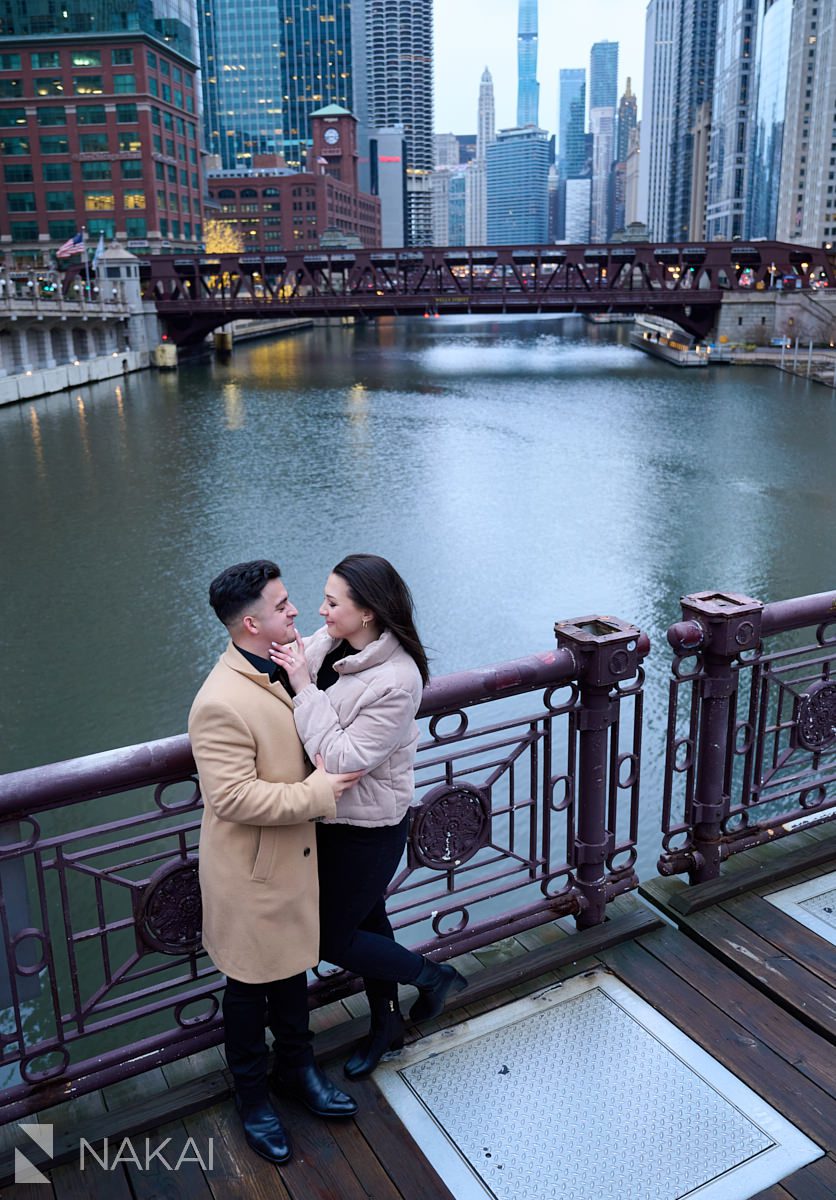 winter Chicago riverwalk proposal photos standing on bridge