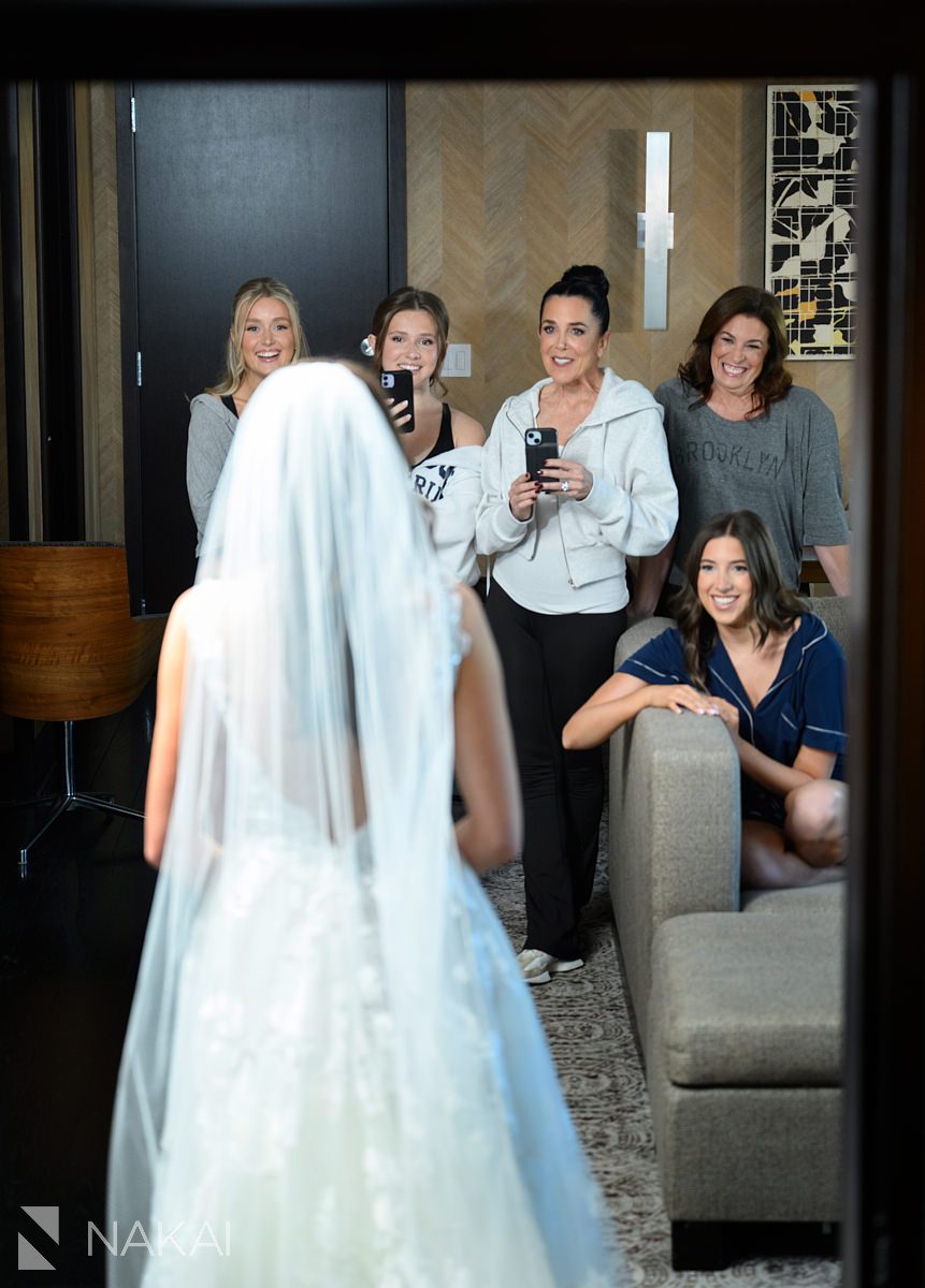 Loews Chicago Hotel wedding pictures getting ready reveal to bridesmaids