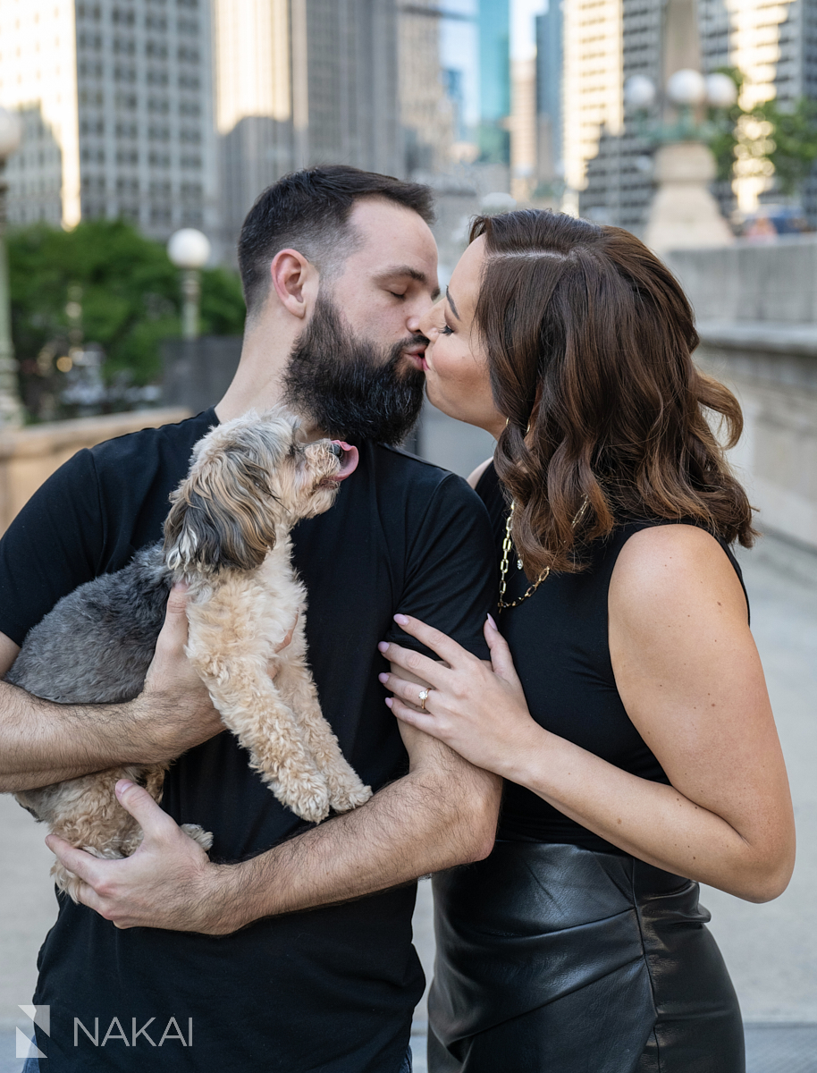 Engagement photo shoot chicago downtown kiss holding a dog