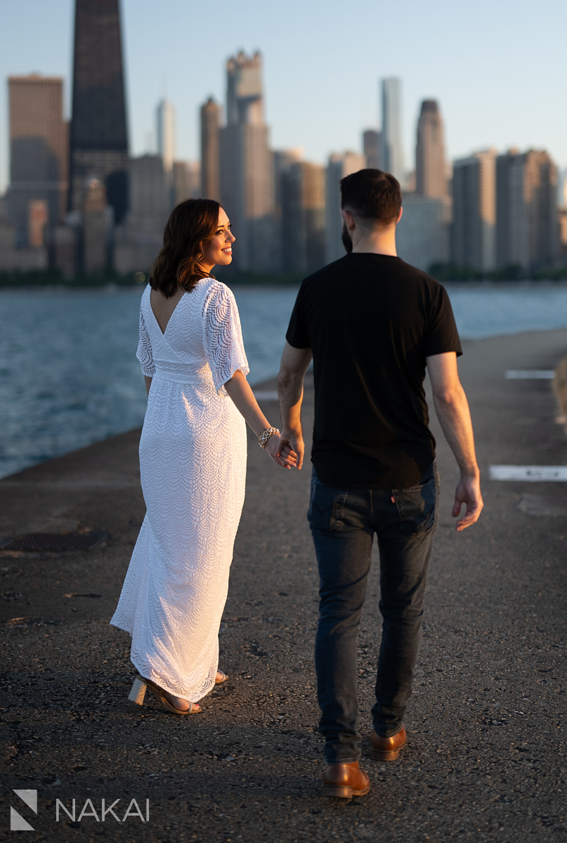Engagement photo shoot chicago north ave pier walking at sunset