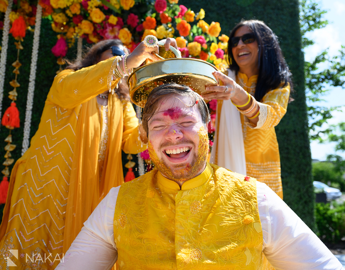 Chicago haldi ceremony photography water on groom