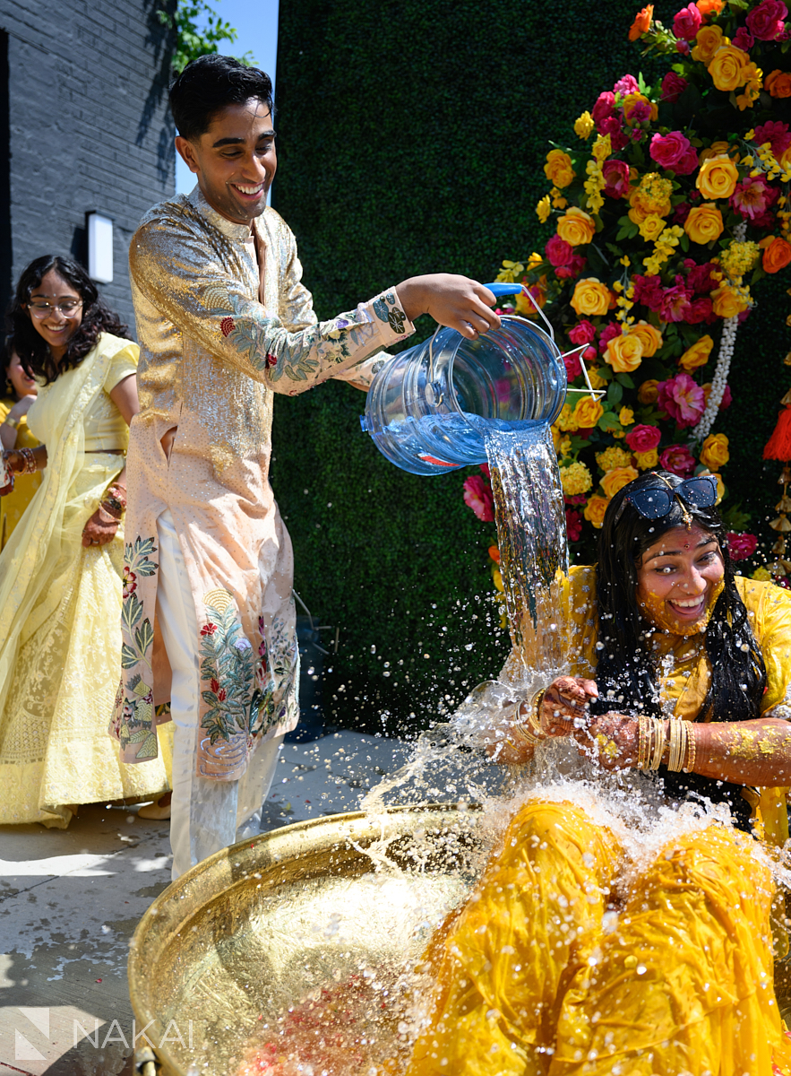 haldi ceremony messy water on bride