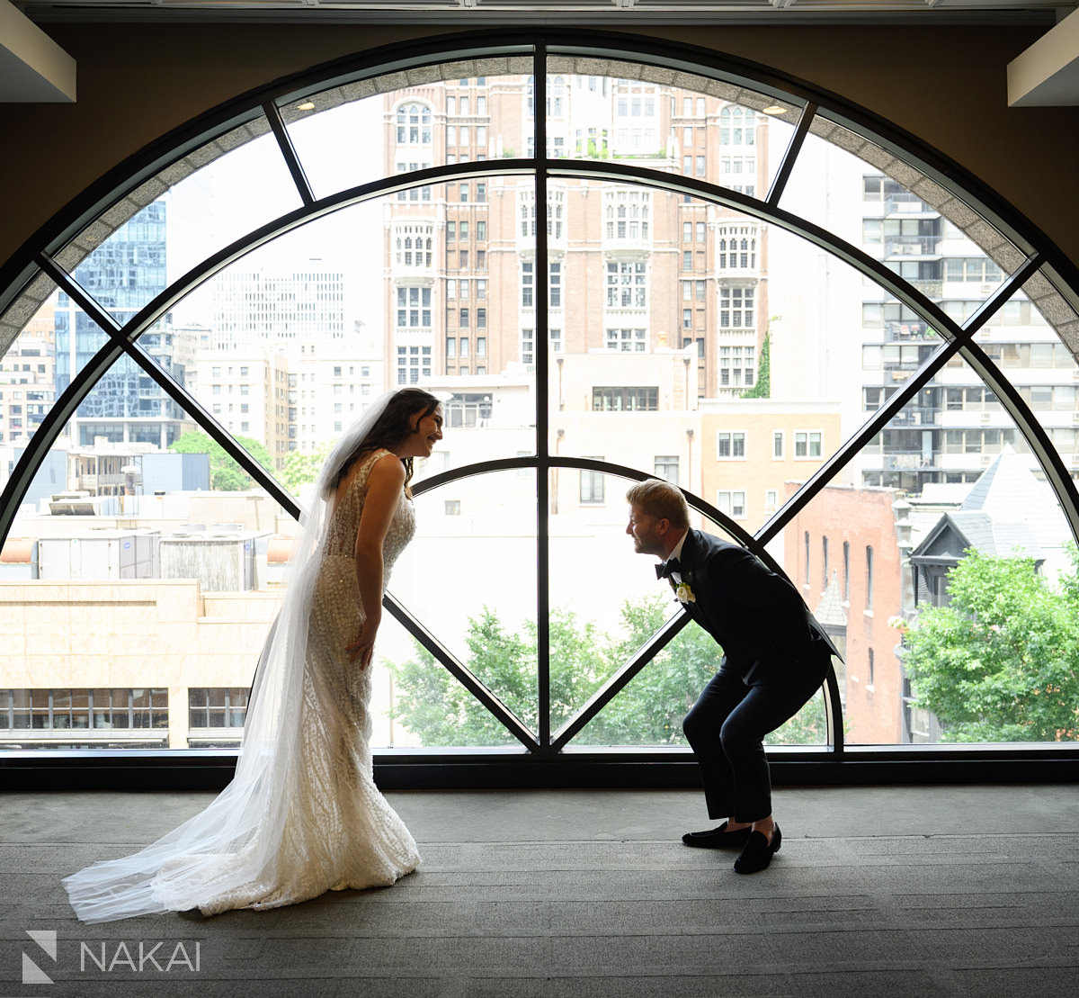thompson chicago wedding first look by large window