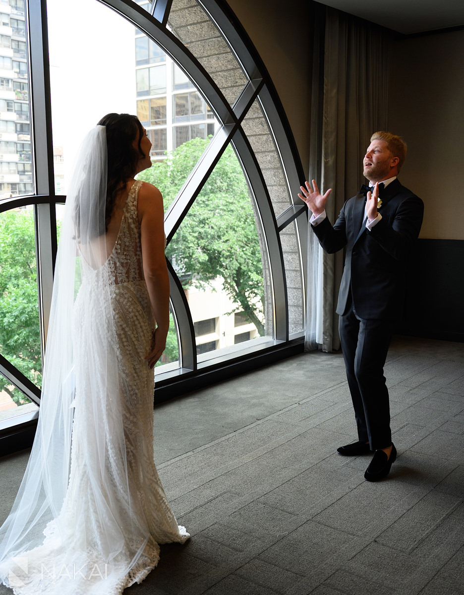 thompson chicago wedding first look by large window