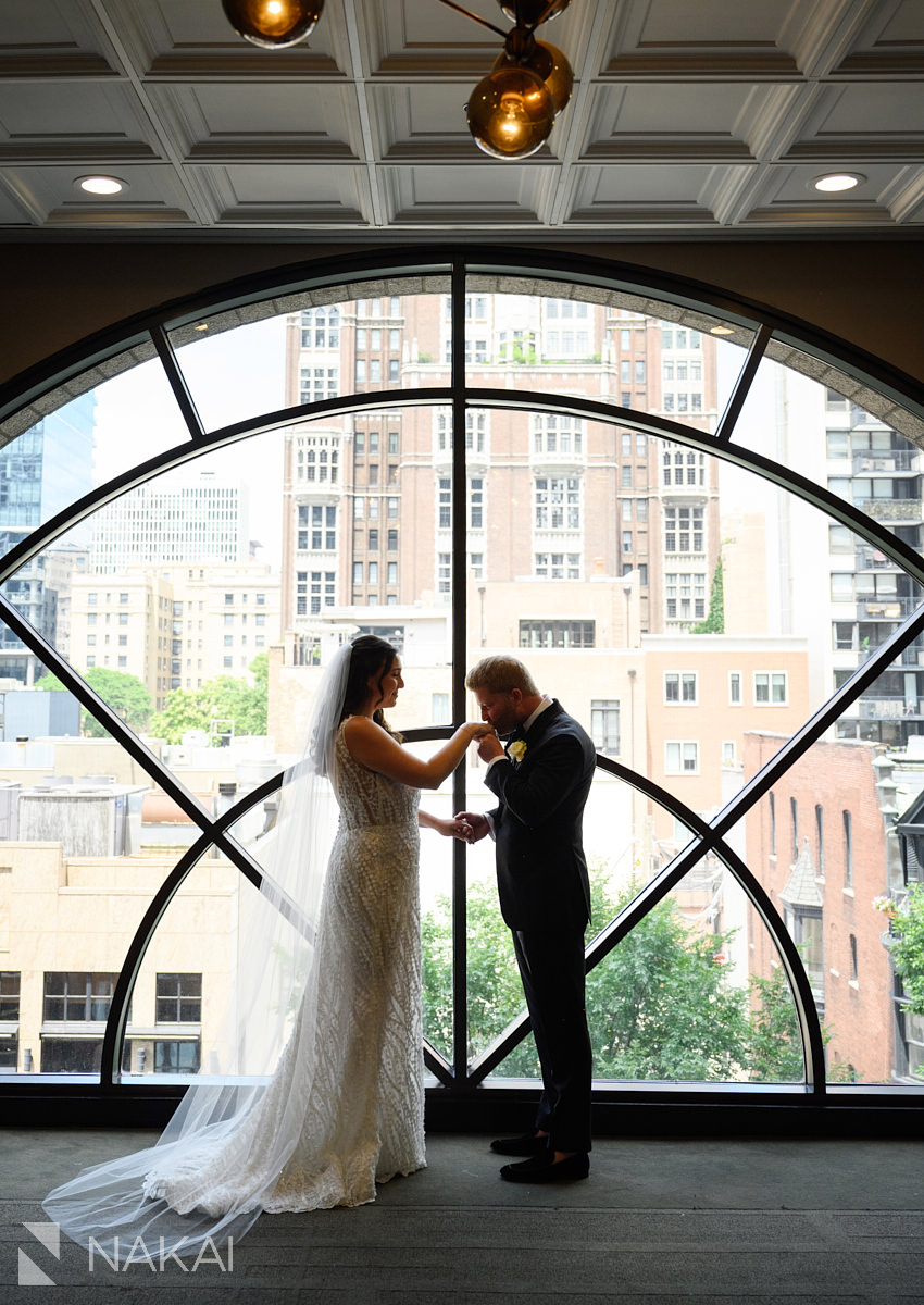 thompson chicago wedding first look by large window