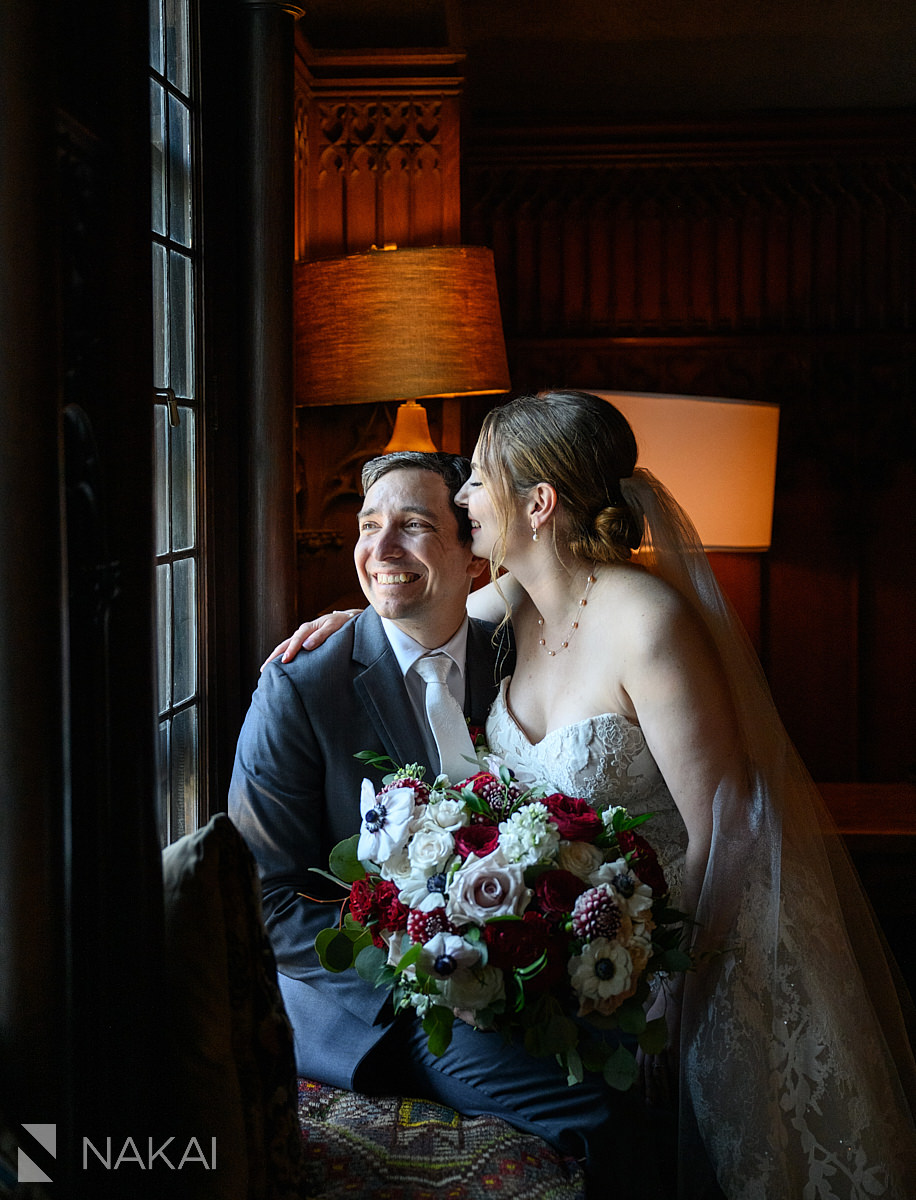 chicago athletic association wedding photos bride groom by window