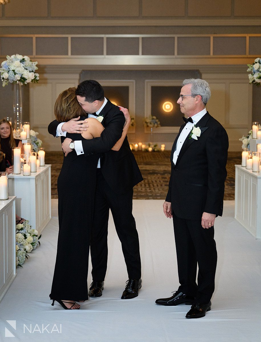 groom hugging mom JW marriott chicago wedding ceremony processional photos