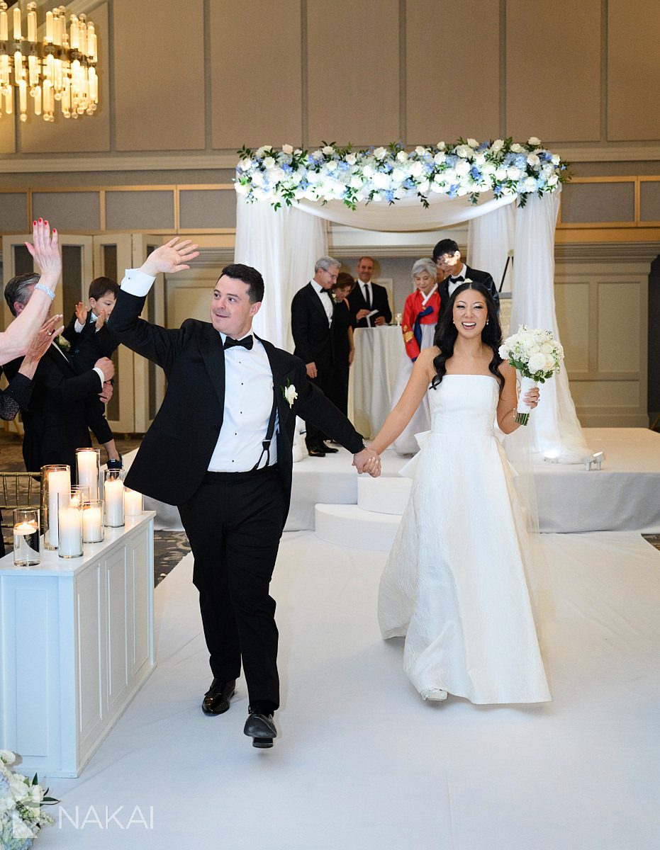 chuppah JW marriott chicago wedding photos couple walking exit