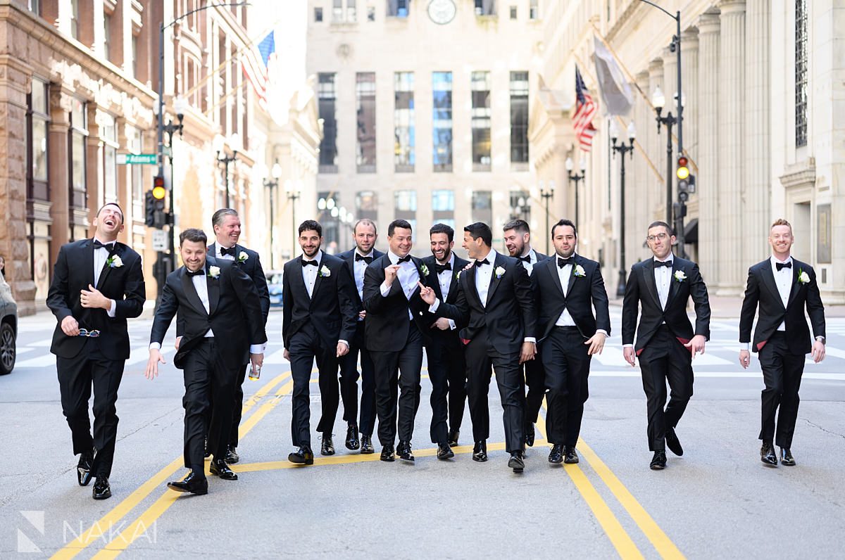 groomsmen walking LaSalle St chicago wedding pictures 