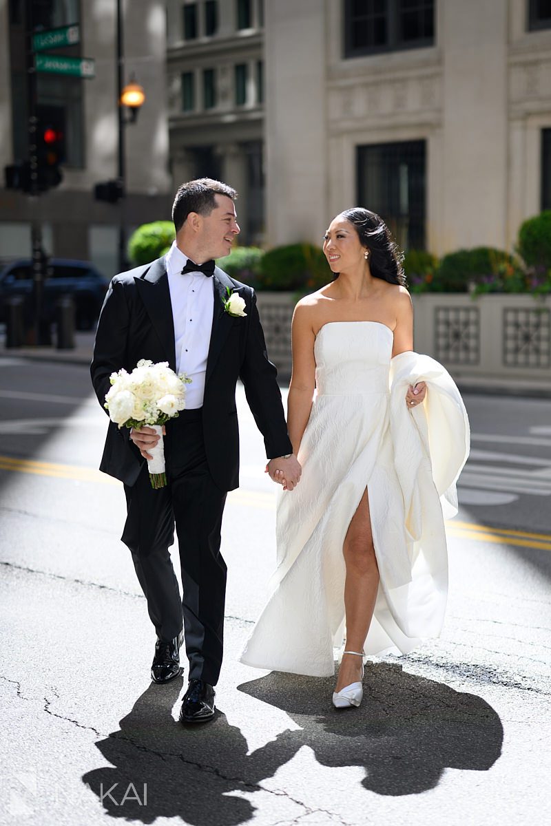 LaSalle Street Chicago wedding photos bride and groom walking in sunshine