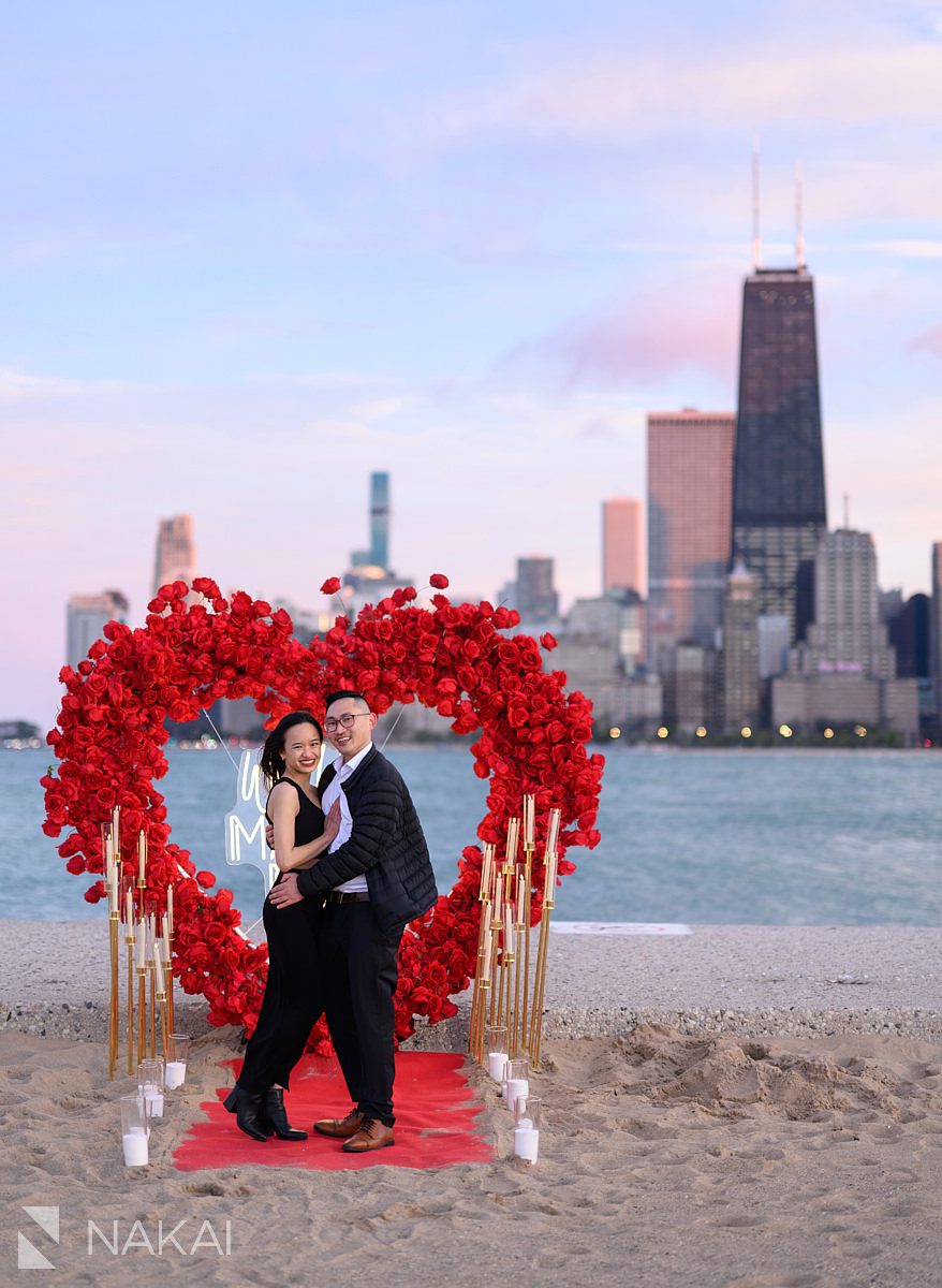 Engagement proposal ideas chicago. A flower wall; Rose heart wreath on North Avenue Beach