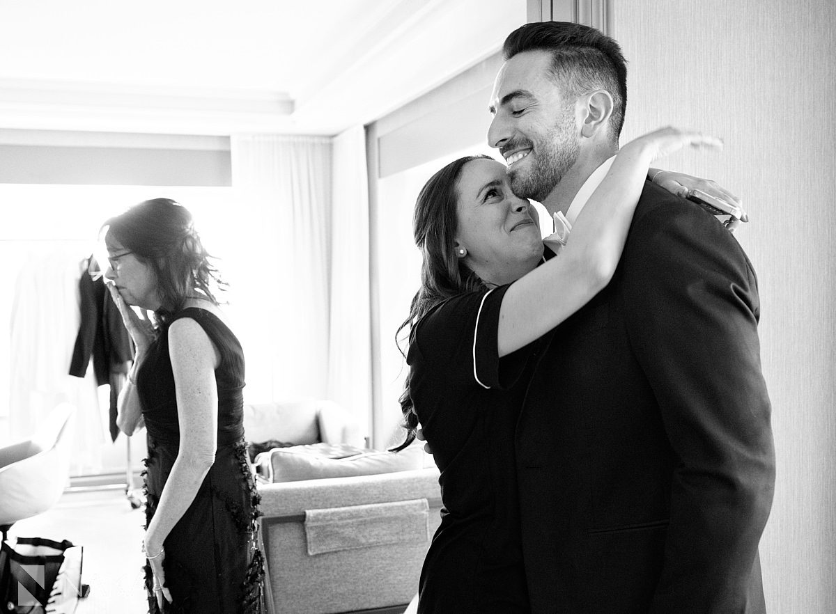 groom hugging Four Seasons Hotel Chicago Wedding photo 