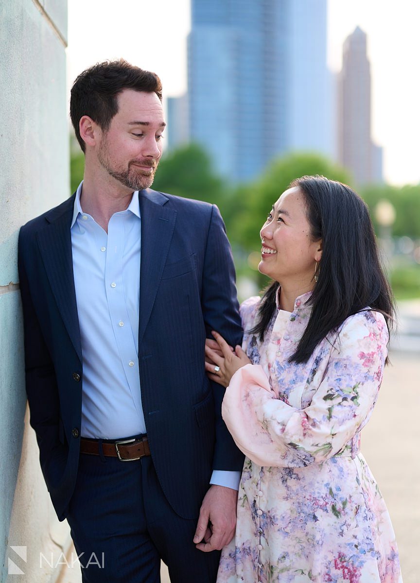romantic museum campus engagement photos laughing at each other