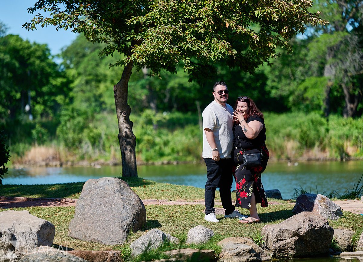 garden of the phoenix proposal photos in Chicago Hyde Park, showing off her ring
