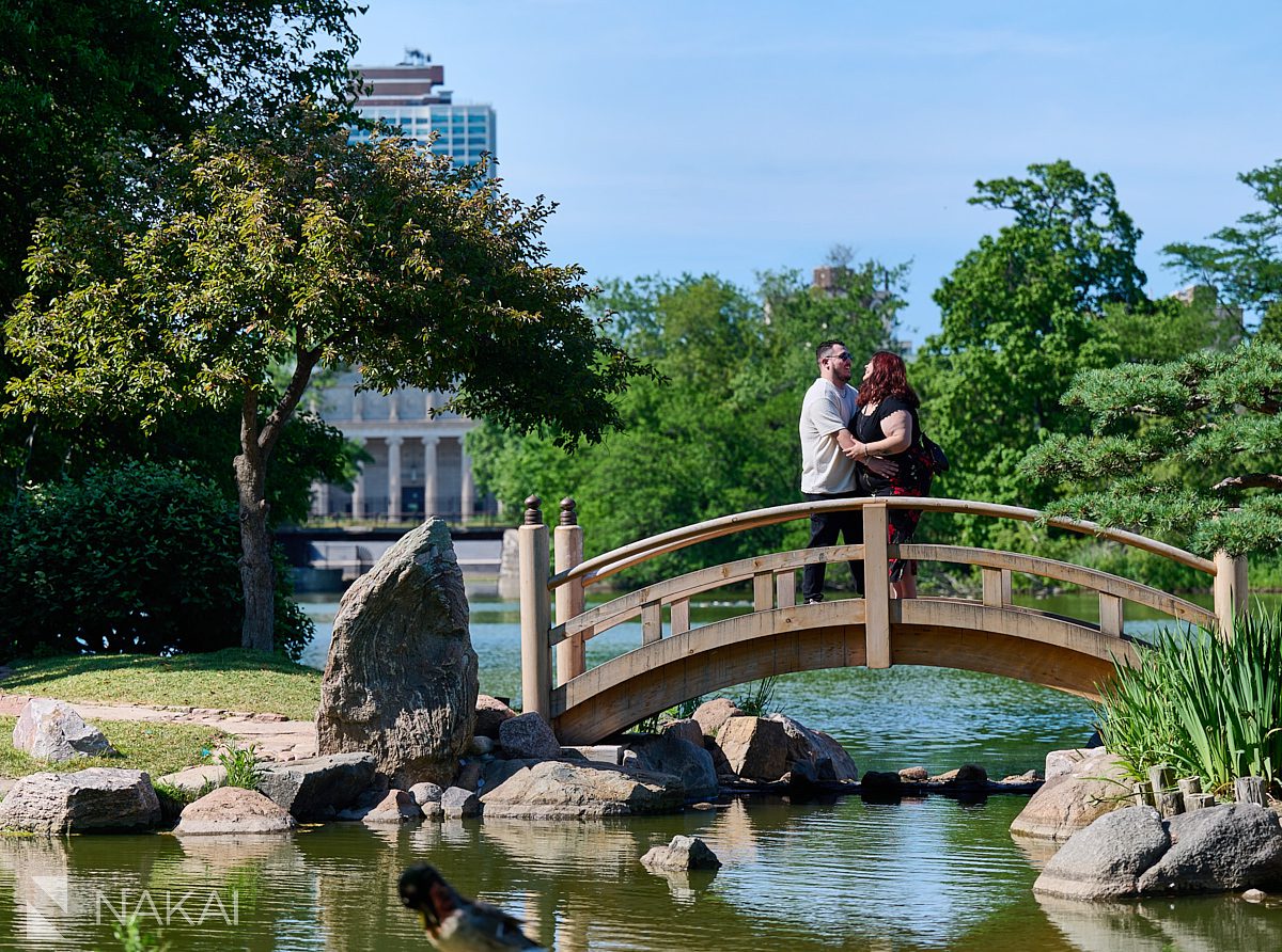 Proposal at garden of phoenix, laughing on bridge in Chicago's Hyde Park