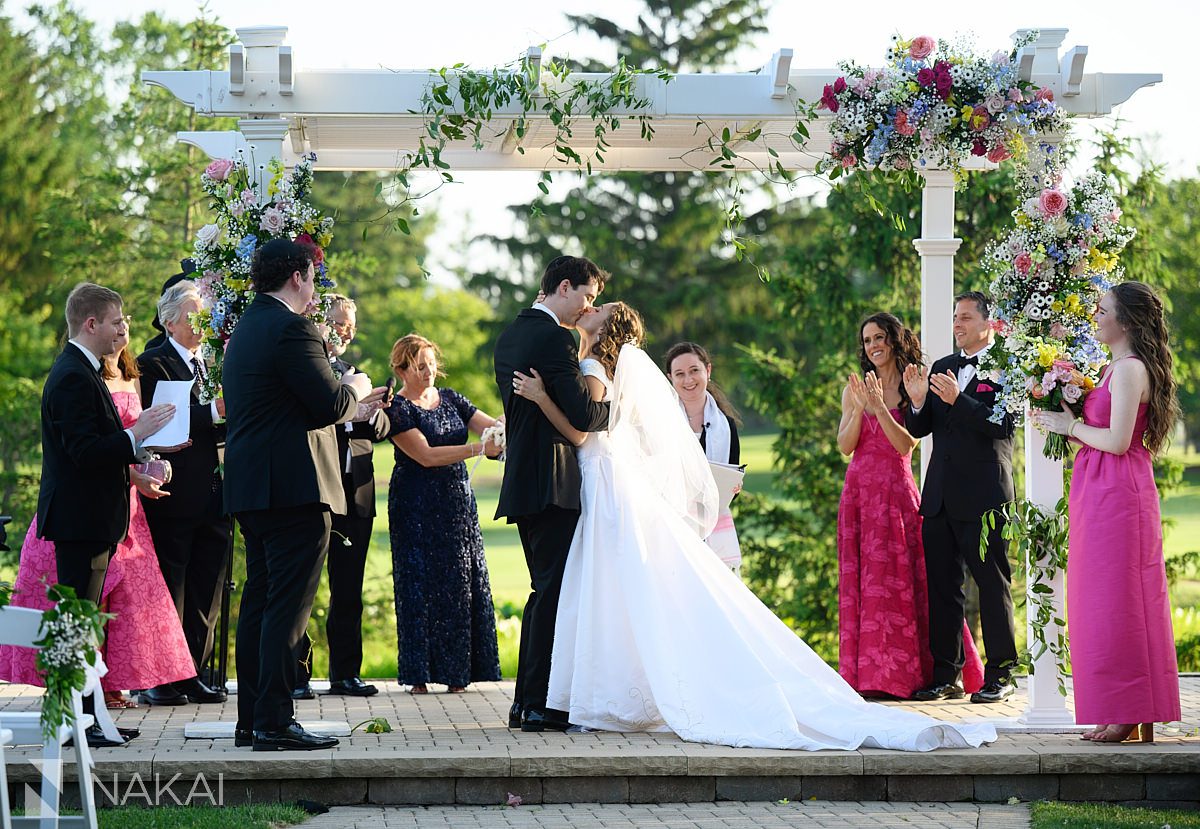 Ravinia Green Country Club Wedding ceremony kiss