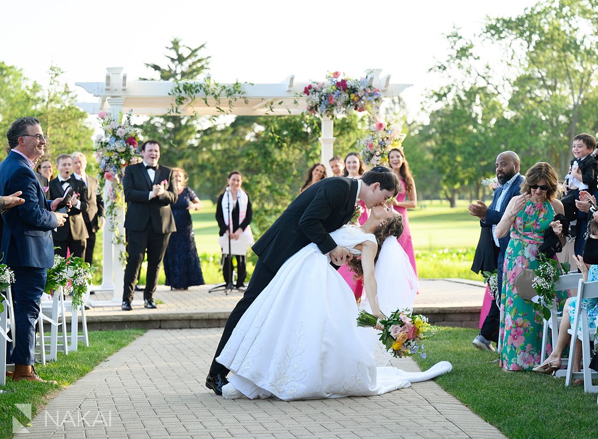 Ravinia Green Country Club Wedding recessional dip kiss