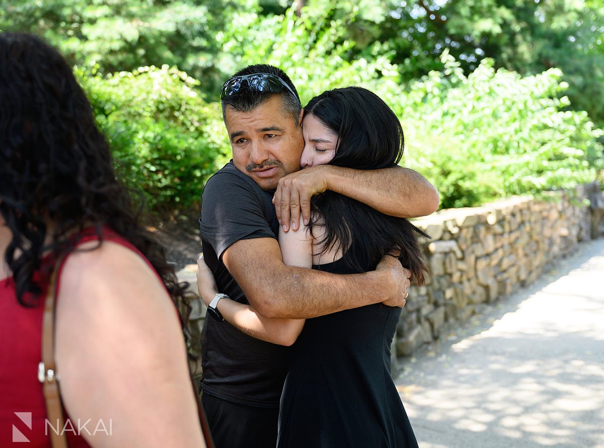 father hugging daughter Chicago botanic gardens proposal photos