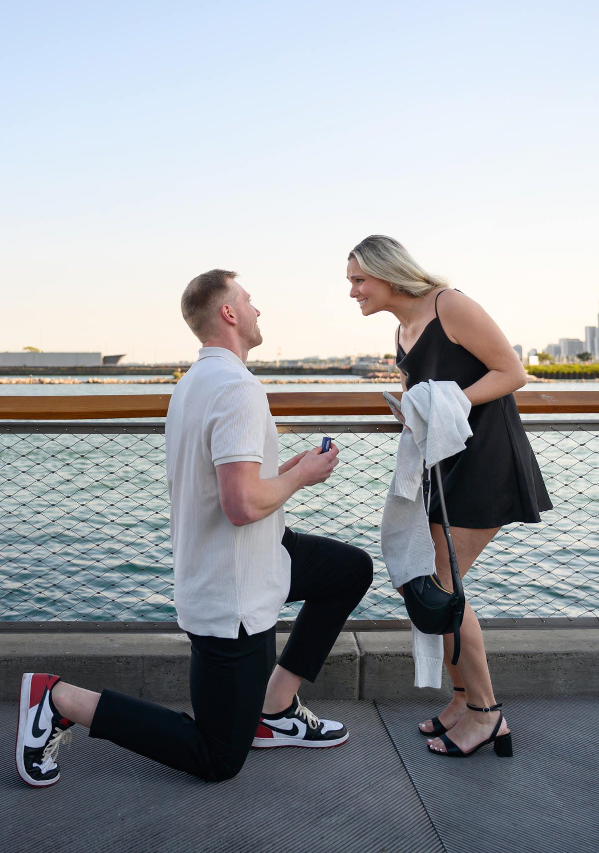 chicago navy pier proposal photos surprised expression on bended knee